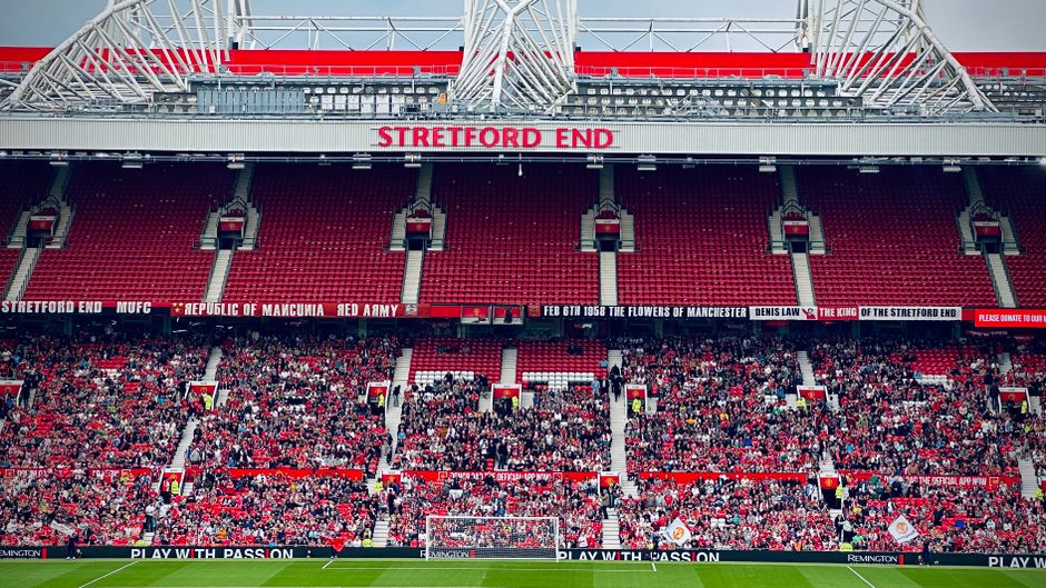 View of the Stretford End crowd at Manchester's iconic stadium during a day event.